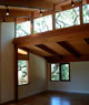 view of clerestory and exposed ceiling from living room 